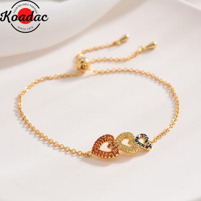 China CLASSIC Triple Heart Pendant Bracelet Women's Gold Love Charms Full Zicron Adjustable Bracelet for sale