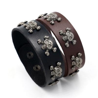 China Punk Leather Bracelets For Men Vintage Alloy Rivet 5pcs Skull Snap Button Wide Cowhide Bracelets for sale