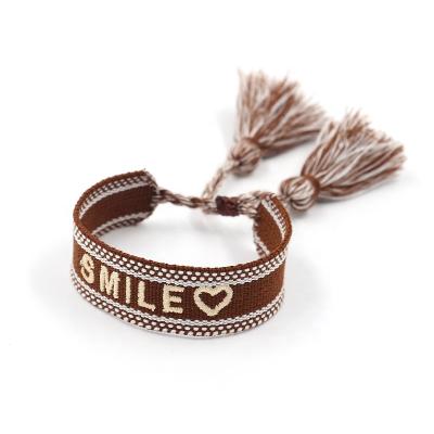 China SMILE Friendship Bracelet Style AdjustableTassel Ribbon Popular Ethnic European and American Embroidered Bracelets for sale