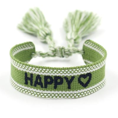 China Ethnic stock wholesale strap braided HAPPY adjustable wrist band embroidery tassel bracelets unisex for sale