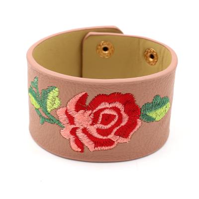 China Customized FASHIONABLE Rose PU Bracelets Logo Embroidered Snap Wide Leather Bracelets for Men and Women for sale