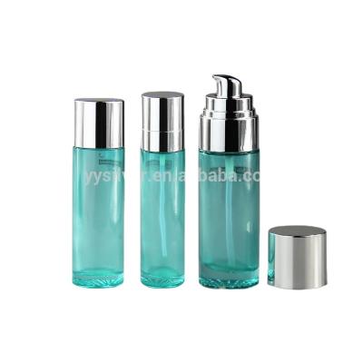 China Personal Care Light Blue Transparent Cosmetic Glass Bottle With Lotion Pump for sale