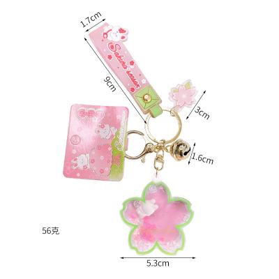 China Creative Promotion Gift Lilangda Amazon Success Liquid Oiled Cherry Blossom Bubble Tea Flower Floating Key Chain Mug Rabbit Keychain for sale