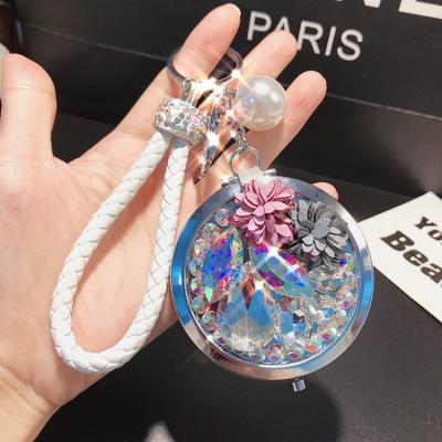 China Lilangda Environmental Friendly Package Portable Folding Key Chain Mini Pocket Makeup Mirror Keychain Stainless Steel Mirror Keychain for sale