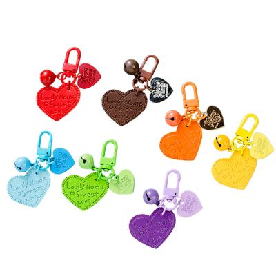 China Car Key Wholesales Leather Metal Gift Key Bell Small Chain Heart Keychains For Women Gift for sale