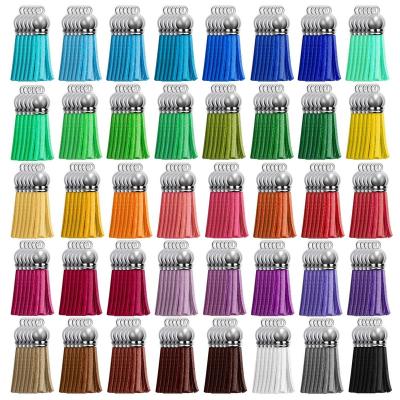 China Lilangda Leather 100 Pieces Leather Tassel For Key Chain Cell Phone Straps Jewelry Summer DIY Charm Designer Key Chain Pendant Charms for sale