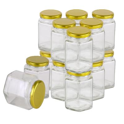 China 380ml food candle jar with lid/hexagon storage hexagon glass jar/manufactures high quality hexagon glass jars for sale