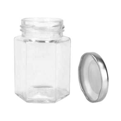 China Empty Hexagon Food 4oz Hexagon Glass Honey Jar With Lid / 4oz Glass Jars With Lid for sale