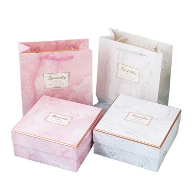 China Recyclable Luxury Folding Paper Pink Flat Pack Cardboard Box Ribbon Closures Book Shaped Gift Box Drawer for sale