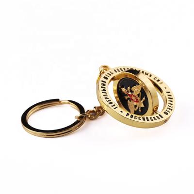 China Gold Logo Rotating Keychain Trend Metal Floating Key Chain Custom Spinning Keyring for sale