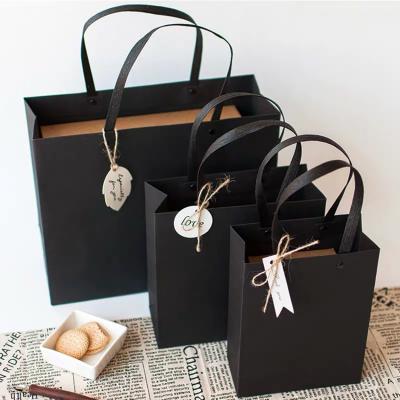 China Recyclable High Quality Stylish Gifts Packaging Black Cardboard Paper Bag for sale