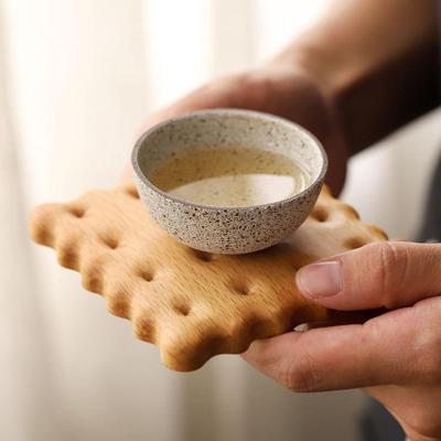 China CSL Folk Art Factory Creative Practical Beech Black Walnut Biscuit Cookie Shape Coffee Cup Holder Wooden Coaster for sale