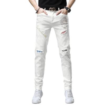 China 2021 winter men's breathable fresh white tapered hole jeans for sale