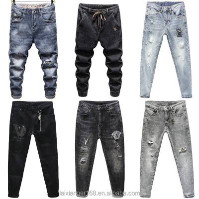 China Wholesale men's fashion jeans QUICK DRY good quality and cheap men's multi-pocket embroidered jeans fashion cut up jeans for sale