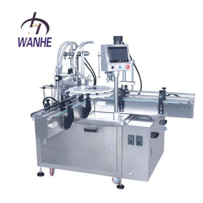 China CLOTHING Wanhe Automatic Small Glass Liquid Bottle Filling And Capping Machine for sale