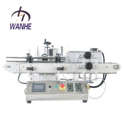 China Automatic Wanhe Commercicial Food Automatic Packaging Labeling Machine For Cosmetics Round Bottles Sticker for sale