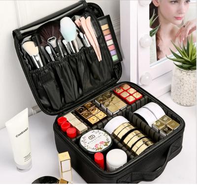 China Waterproof Ready Running Black Travel Makeup Bag Professional Cosmetic Case Travel Makeup Bag With Adjustable Dividers for sale