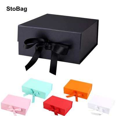 China Custom Logo Foldable Cardboard Bow Packing Materials Recycled Paper Foldable Gift Box Gift Wrapping Materials With Ribbon Closure for sale