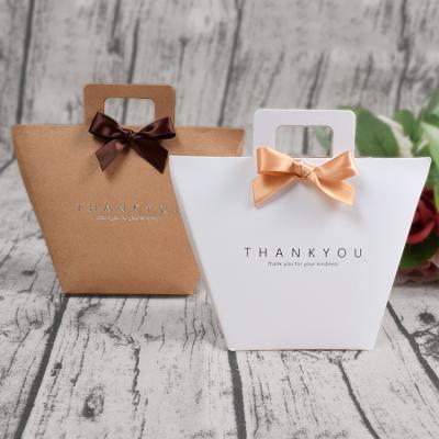 China Custom Luxury Foldable Recyclable Recyclable Paper Bag Bow Decoration Gift Shopping Packaging Thank You Paper Bag for sale