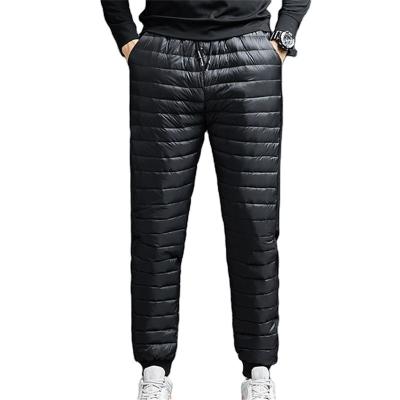 China Korean Style Men's Windproof Pants Winter Big Size Duck Down Skiing Long Padded Black Luxury Cotton-Padded Windproof Pants For Men for sale