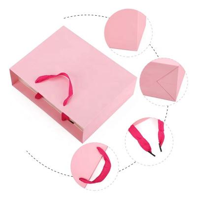 China Recyclable Wholesale Pink Jewelry Packaging Paper Bag With Different Sizes for sale