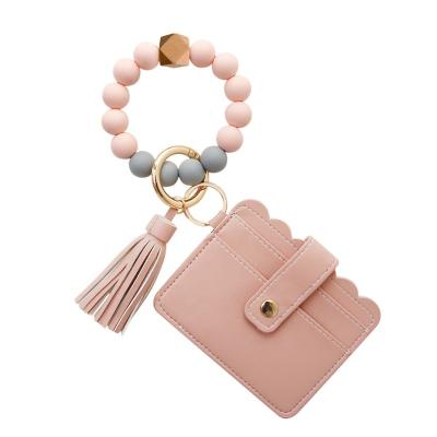 China No Key Chain Bag Hot Sale PU Tassel Card Bag Leather Silica Gel Beads Wristband Key Chain Pouch for sale