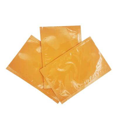 China Aluminiumfolie gelamineerd glanzend oranje kleur aangepaste platte zakken voor gezichtsmasker plaat, gezichtscrème verpakking Te koop