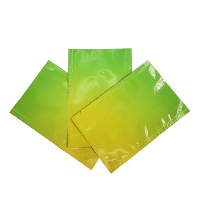 China Custom Design Glossy Green Yellow Gradient Color Flat Zipper Pouch with Foil Lined for Food Packaging for sale