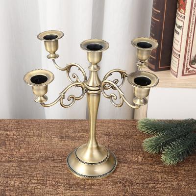 China Romantic Luxury Metal Candle Holders Weddings Bronze Silver Gold 5 Glow Candle Holders Other Stand Wedding Decorations Metal Candlestick for sale