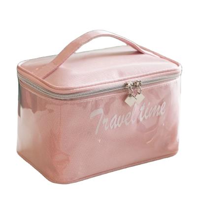 China Luxury Pink Transparent Makeup Bag Travel PU Jelly Cosmetic Bag Label Small Cosmetic Bag With Handle for sale