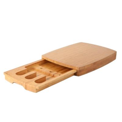 China Sustainable Natural Bamboo Cheese Board With Hidden Slide-Out Drawer For Cheese Knives Cutlery for sale