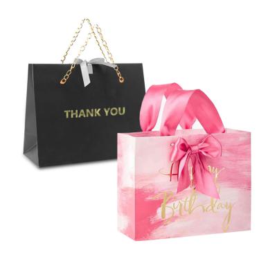 China Recyclable Custom Logo Printed Matt Laminated Pink Paper Shopping Bag With Grosgrain Ribbon Handle for sale