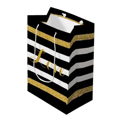 China Recyclable Modern Luxury Black And White Gloss Gold Glitter Bars Paper Gift Carrier Bags For Return Gifts for sale