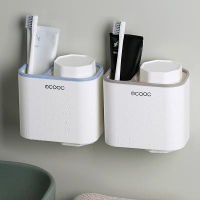 China Simple Sustainable Modern Plastic Magnetic Wall Mounted Toothbrush Holder With 2 Tooth Wash Cups For Bathroom for sale