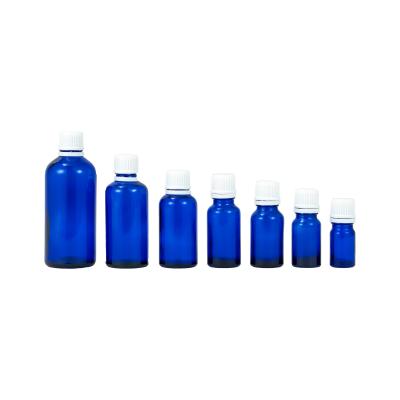 China Eco-friendly Recyclable 5ml 10ml 15ml 20ml 30ml 50ml 100ml Cobalt Blue Essential Oil Refillable Glass Bottle With Tamper Resistant Seal for sale