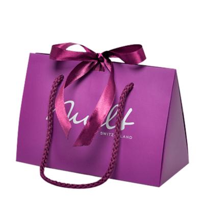 China Recyclable Luxury Custom Printed Purple Full Logo Printed Cardboard Paper Pouch Bag With Ribbon Bowknot Handle For Gifts Shopping Boxes for sale