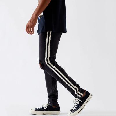 China Breathable Custom Logo Black Button Zip Fly Side Stripe Ripped Stacked Skinny Jeans For Man for sale