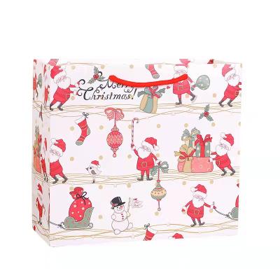 China Wholesale Recyclable Price Christmas Promotion Large Paper Handbag Gift Packaging Bag for sale