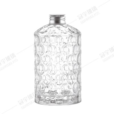 Chine Logo personnalisé Acceptable Bouteille de verre concave et convexe à Direct Chinois pour la décoration à vendre