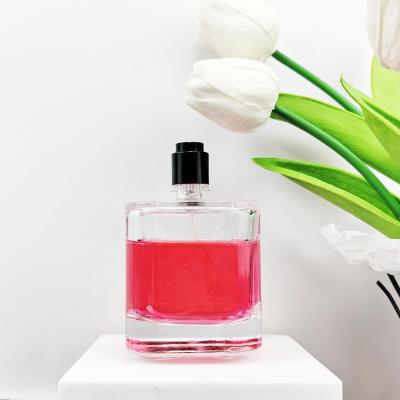 China Material del cuerpo de vidrio Botella única de perfume vacía de 100 ml con pulverizador y tapa de corcho en venta