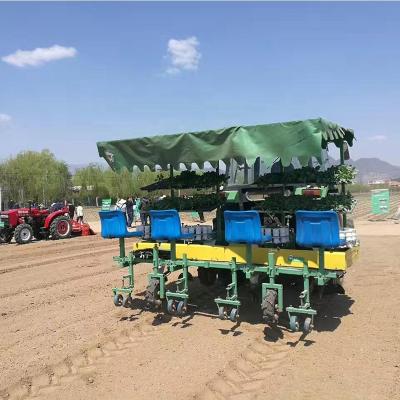 China Farmland four lines pot plant bacco caterpillar transplanting machine modern seedling vegetable efficient agricultural equipment wide range of uses for sale