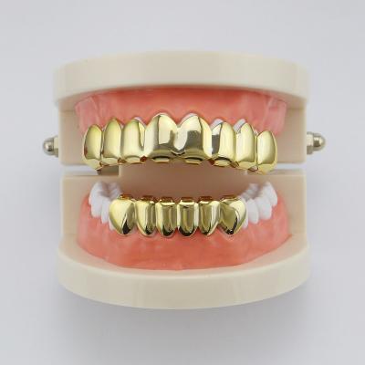 China FASHIONABLE Wholesale Hip Hop Gold Teeth Grillz Top Striker Jewelry and Tooth Teeth Lower Dental Mouth Grills Cosplay Party Punk Gift for sale