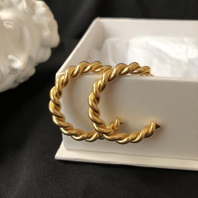 China Trendy Minimalist 18k Gold Plated Stainless Steel Hoop Earrings Jewelry CC Twisted Hoop Earrings for sale