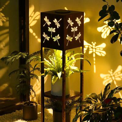 China Ip65 Dragonfly Cavity Waterproof Eco-friendly Shell Light Solar Premium Metal Warm Flower Stand Lighting Modern Solar Light For Decoration for sale