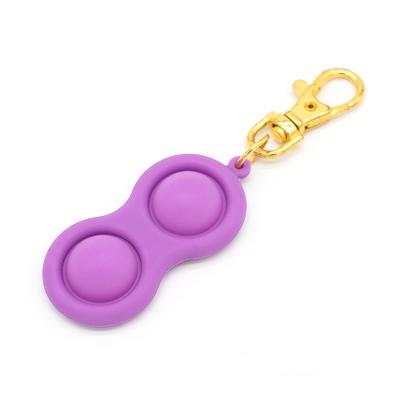 China Dimple For The Kids Popular Simple Dark Pack Fidget Dimple Keychain Glow In The Sensory Simple Toys Mini Pop Keychain for sale