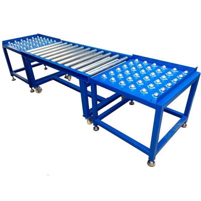 China Manufacturer Heat Resistant Custom Gravity Ball Supporting Universal Transfer Conveyor System Table Ball Conveyor for sale