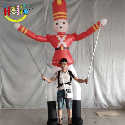 China Inflatable Promotion Cartoon Inflatable Movable Suit Soldier Inflatable Puppet With Long Leg for sale