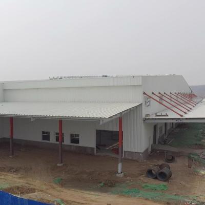 China Light Steel Frame Structural Workshop Warehouse Factory Low Cost Prefab Factory Building With Sliding Door for sale