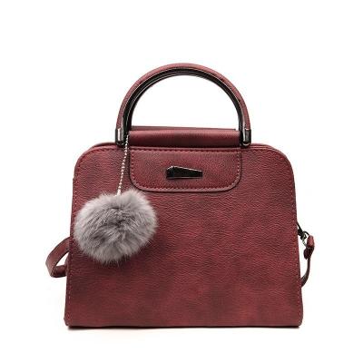 China Fashion Mini Cheap Pom Pom Lady Handbag Plain Pattern for sale