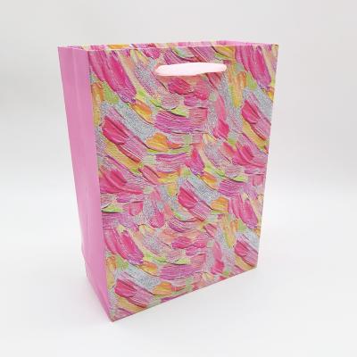 China M Wholesale Luxury Recyclable Shinny Glitter Purse Shopping Gift Packing Printed Paper Bag With Ribbon Handle for sale